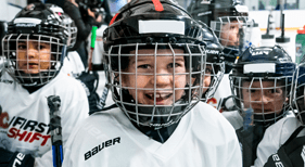 Young hockey playing smiling