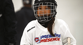 Young hockey playing smiling